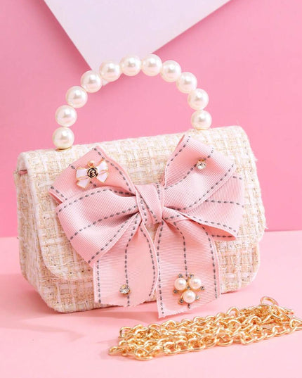 Mini princess bow handbag for girls

Girls beige handbag with rhinestones and chain strap